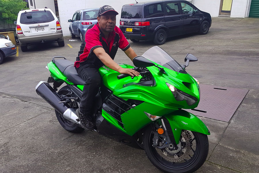 Kawasaki motorcycle outside the workshop
