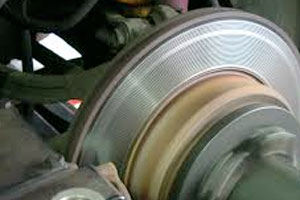 Brake disc being machined on a vehicle
