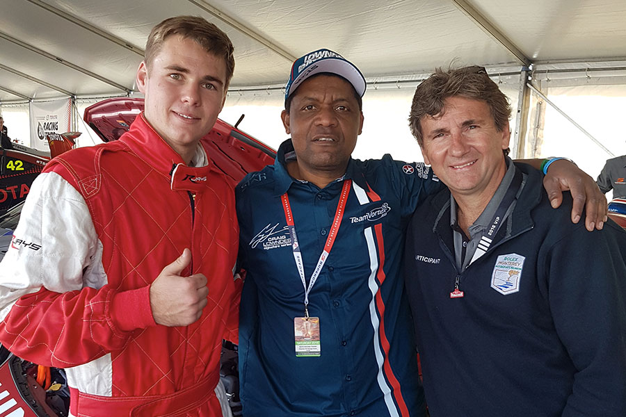 Lanny with drivers at a motorsport event